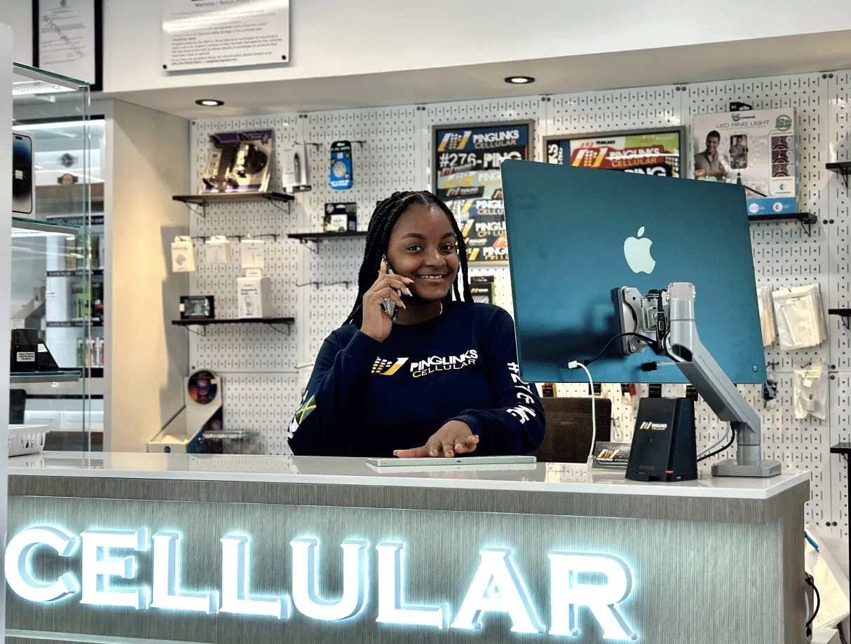 Pinglinks staff member at the store counter